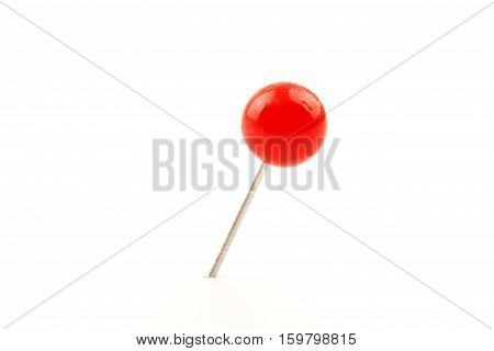 Macro close up of Red Push Pin isolated on white background.