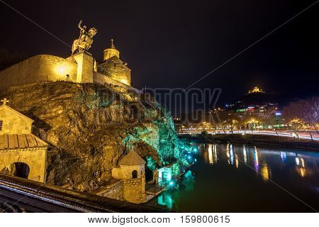 Night Evening Illuminated View Of The Metekhi Church And The Equestrian Statue Of King Vakhtang Gorg