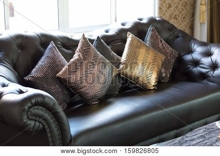 black leather sofa in luxurious interior roomselective focus.