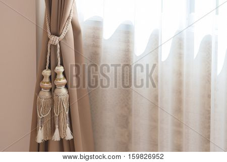 beautiful curtain tie by curtain strap with sunlightselective focus.