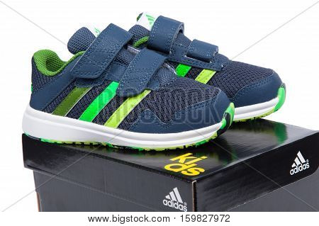 Varna Bulgaria - APRIL 9 2016 : ADIDAS SNICE 4 CF children shoe. Isolated on white. Product shot. Adidas is a German corporation that manufactures sports shoes clothing and accessories