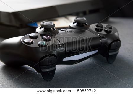WROCLAW POLAND - NOVEMBER 30th 2016: DualShock 4 on desk. The DualShock 4 is the PlayStation 4's controller.