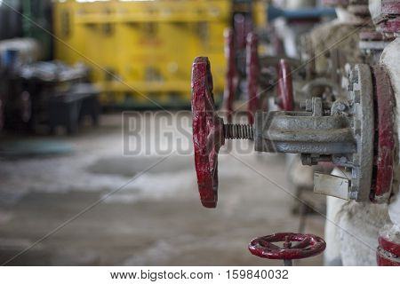 abandoned factory old painted red, mechanical valve