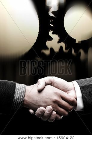 stretta di mano con sfondo di ingranaggi