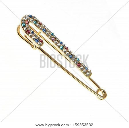 elegant safety pin broche isolated on white background