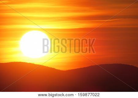 Cloudy sunset above the mountains. Quebec, Canada.