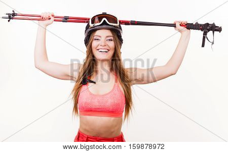 Woman Wearing Ski Suit And Helmet Holding Poles