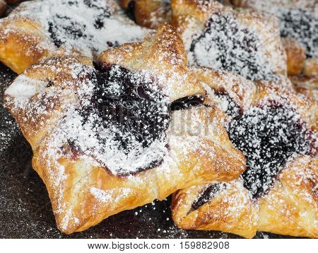 Danish Pastry With Blueberry Jam Filling With White Powdered Sugar