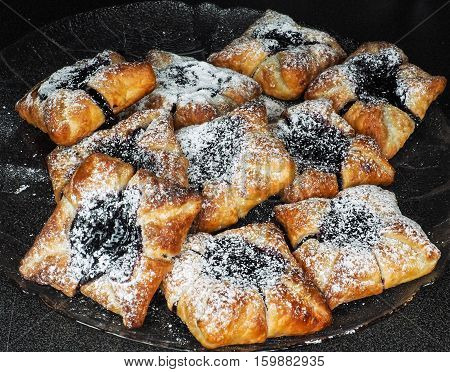 Danish Pastry With Blueberry Jam Filling With White Powdered Sugar