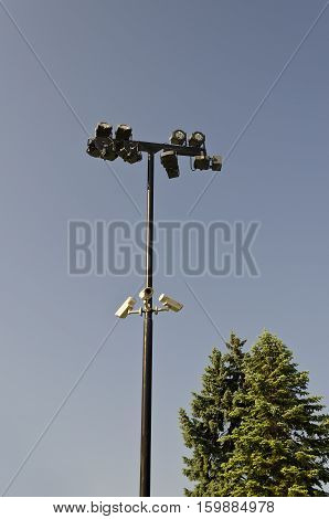 Security CCTV camera on street lamp in the city center