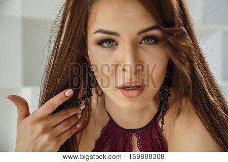 Beautiful Sexy Brunette Posing In Swimsuit On White Background