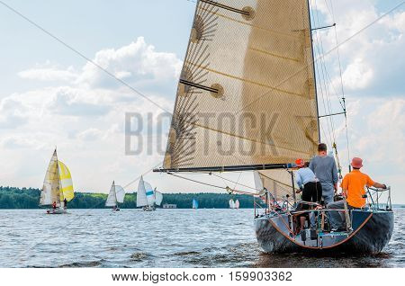 Sailing yacht race. Team athletes participating in the sailing competition