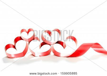 red heart ribbon isolated on white background. studio shot