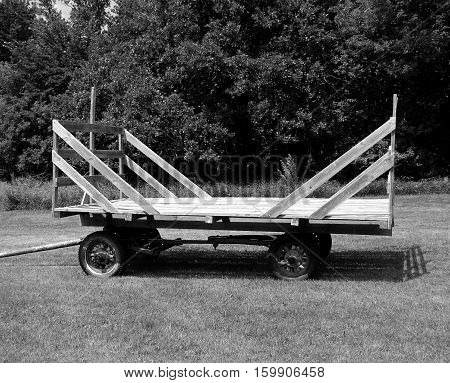 A loose hay hayrack in grayscale it was used a lot before 
farmers started baling hay.