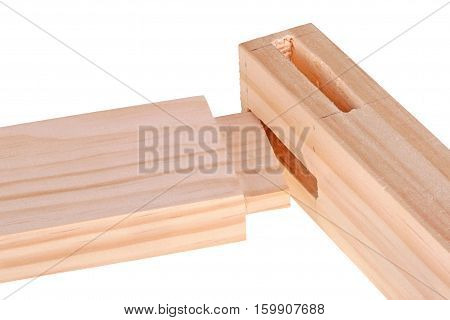 Close-up of the ends of pine boards with two freshly cut woodworking mortises and a tenon isolated against a white background