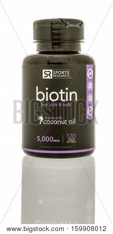 Winneconne WI - 3 December 2016: Bottle of Sports Research biotin on an isolated background.