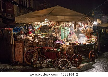 POLAND KRAKOW - JANUARY 01 2015: Festive New Year Fair in night Krakow on the Main Market Square in the historic center of the old town.