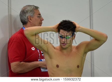 Hong Kong China - Oct 29 2016. Hungarian swimmer Gergely Gyurta and his coach Ferenc Kovácshegyi. FINA Swimming World Cup Victoria Park Swimming Pool.