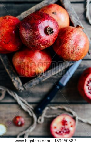 Ripe Pomegranate Fruit On Wooden Vintage Background. Red Juice P