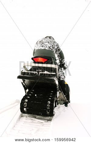 Man on snowmobile. Recreation concept on nature in winter holidays. Winter sports.