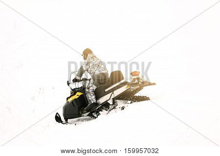 Man on snowmobile. Recreation concept on nature in winter holidays. Winter sports.