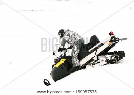 Man on snowmobile. Recreation concept on nature in winter holidays. Winter sports.