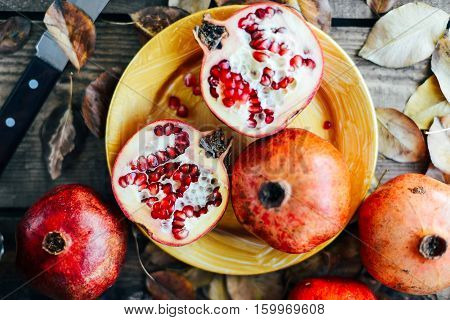 Ripe Pomegranate Fruit On Wooden Vintage Background. Red Juice P