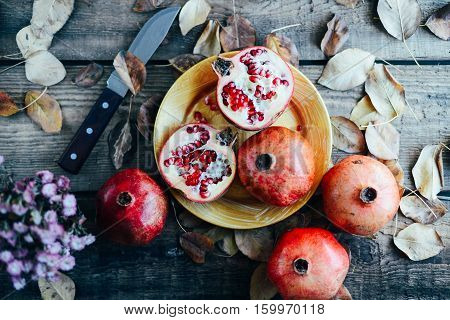 Ripe Pomegranate Fruit On Wooden Vintage Background. Red Juice P
