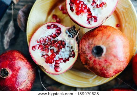 Ripe Pomegranate Fruit On Wooden Vintage Background. Red Juice P