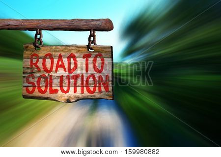 Road to solution motivational phrase sign on old wood with blurred background
