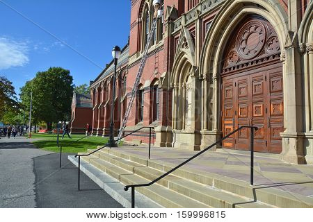CAMBRIDGE USA - OCTOBER 20 2014: Harvard Memorial Hall doors. Harvard is the most prestigious and oldest university in United States