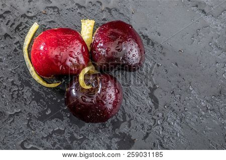 Precious Red And Fresh Cherry Pints, Fresh And Raw On A Textured And Veined Black Background. With L