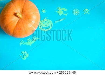 Halloween Background With One Pumpkin On Rustic Blue Background, Selective Focus With Copy Space For