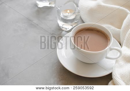 Still Life Details In Home Interior Of Living Room. Cup Of Cocoa On A Table, Candles And Knited Blan