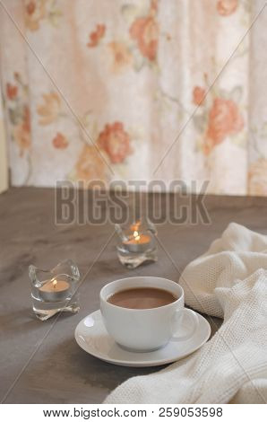 Still Life Details In Home Interior Of Living Room. Cup Of Cocoa On A Table, Candles And Knited Blan