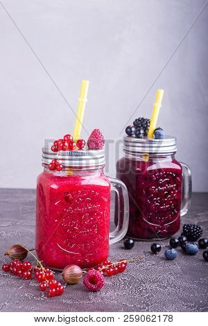 Summer Smoothies Of Raspberries, Red And Black Currant, Goosberries, Blueberries, Blackberries In Gl