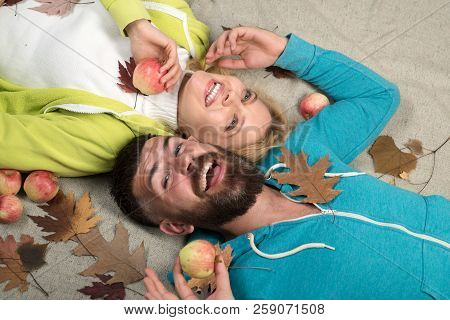 Romantic Couple Wearing Pullover On Autumn Leaves Background. Happy Family In Autumn. Autumn Trend A