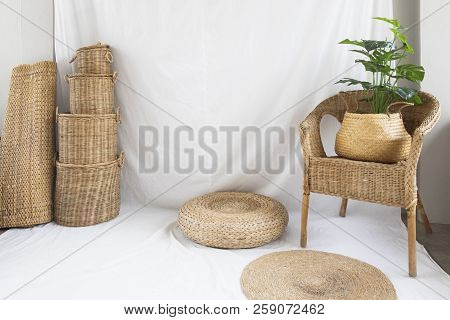 Background And Texture Of Wicker Chair And Basket Weave On White Fabric. Decorations With Tree.