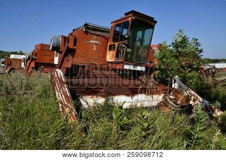Valley City, North Dakota, August 21, 2018: The Faded  Red Junked Combine Is An International 403 Wh