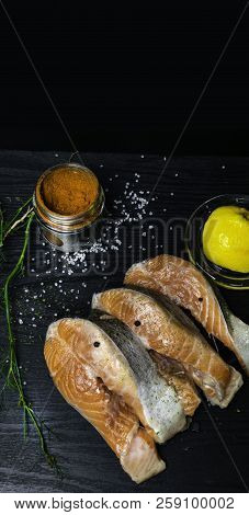 Fresh Trout Or Salmon Fish With Spices On Wooden Background