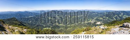 Panoramic View From Summit Of Mountain Hochlantsch Over The Valley To Mountain Rennfeld In Styria, A