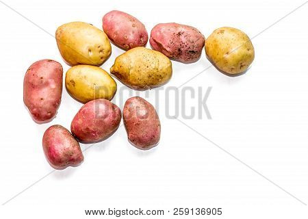 Potatoes On A White Background From The Garden At The Dacha. Assorted Potatoes. Red Scarlet, Gala.