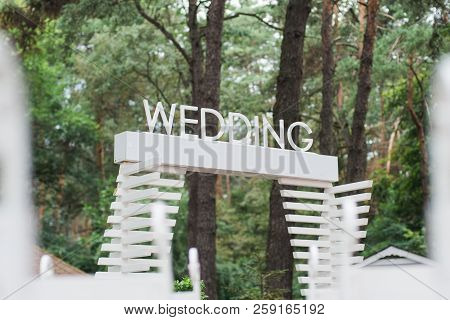 Wooden Plaque With The Inscription Wedding. Decorations