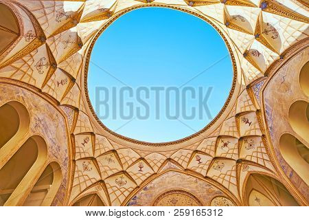 Kashan, Iran - October 22, 2017: The Scenic Dome With Muqarnas Decors, Painted Arabesques And The Li