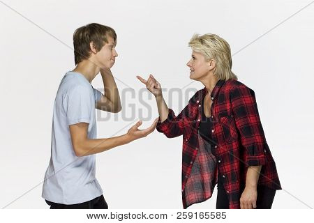 Generation Gap. Male Teenager Is Arguing With His Mother