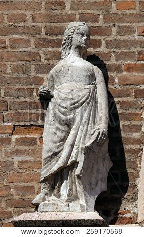 VERONA, ITALY - MAY 27: Female statue on the portal of Saint Eufemia Gothic-style, Roman Catholic church in Verona, Italy, on May 27, 2017.