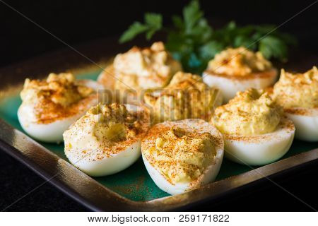 Deviled Eggs On A Plate With Paprika