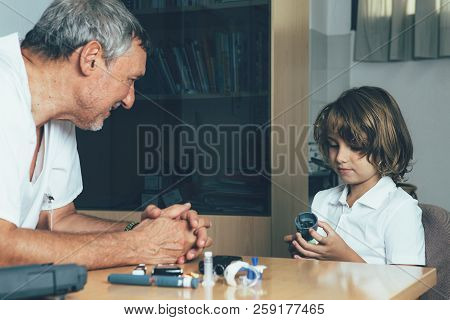 Young Diabetic Patient Is Holding The Insertion System Of The Infusion Set Of A Insulin Pump While T