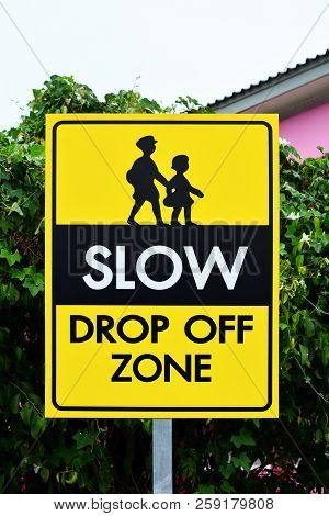 Slow Down Drop Off Zone Warning Yellow Banner Traffic Sign At The School