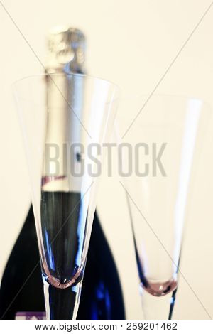 Bottle Of Shampagne And A Two Empty Glasses Before Drinking Isolated On Thw White Background